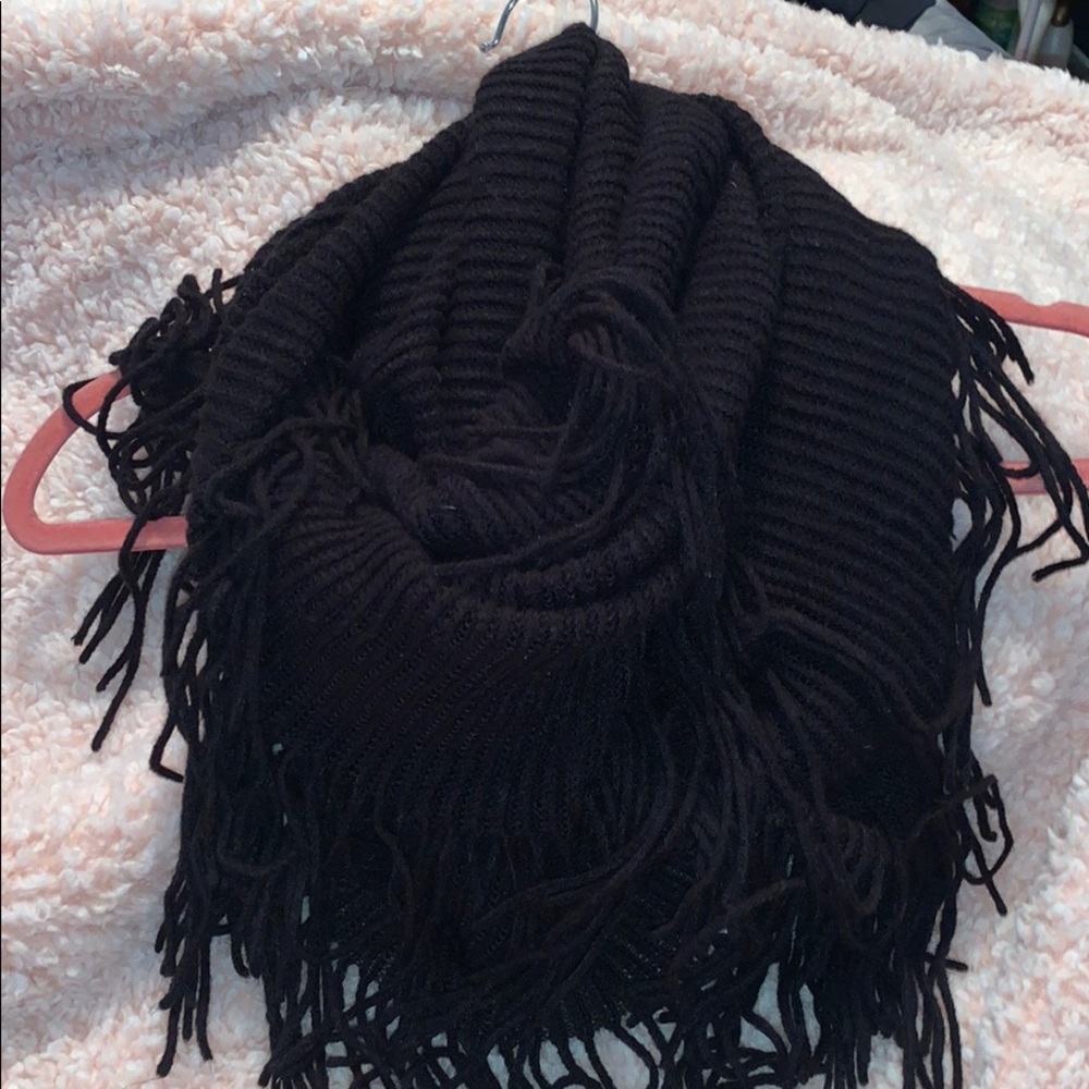 Black knit infinity scarf with fringe detailing